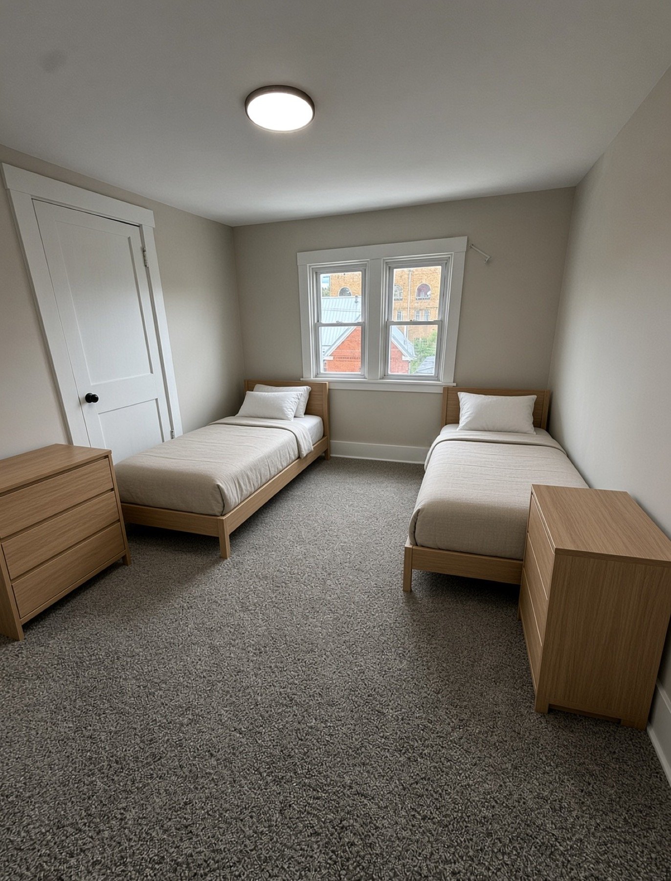 Second shared bedroom with two twin beds and dressers
